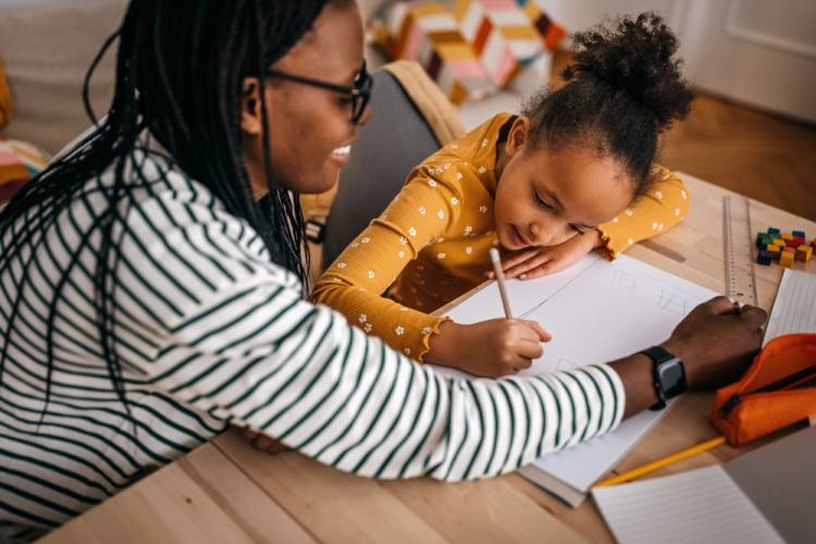 mother and child doing homework together