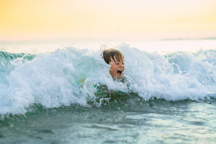 little boy in the ocean